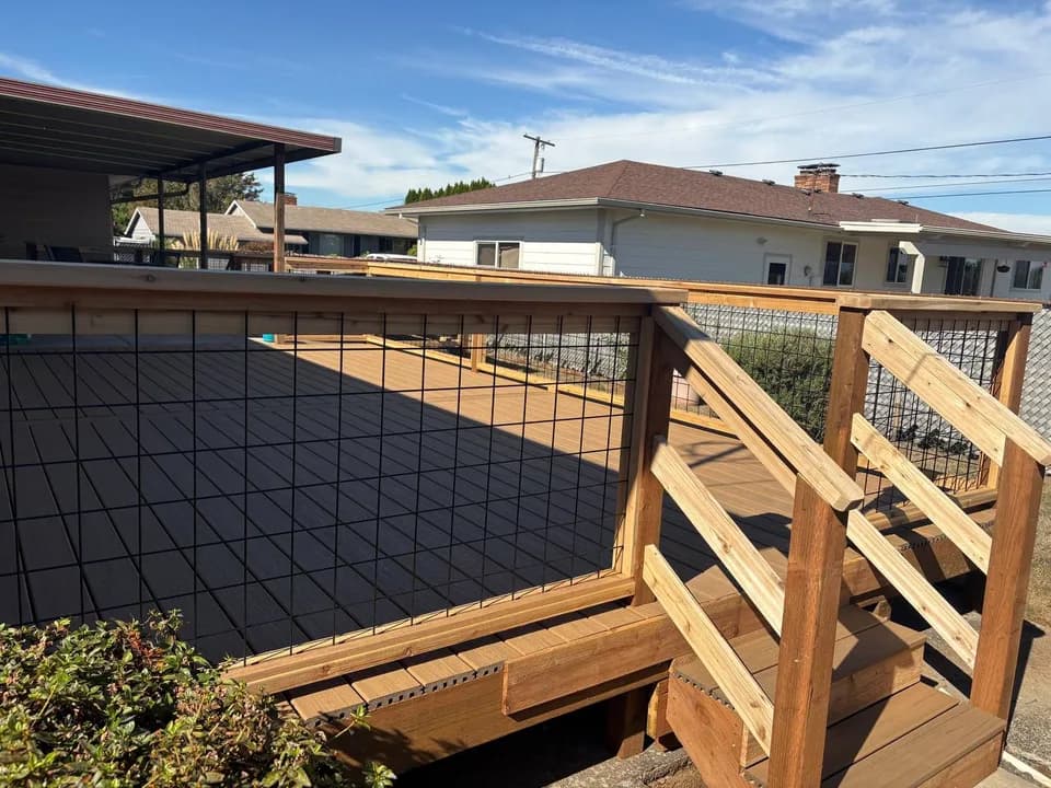 Composite deck with hog-wire railing and cedar stairs